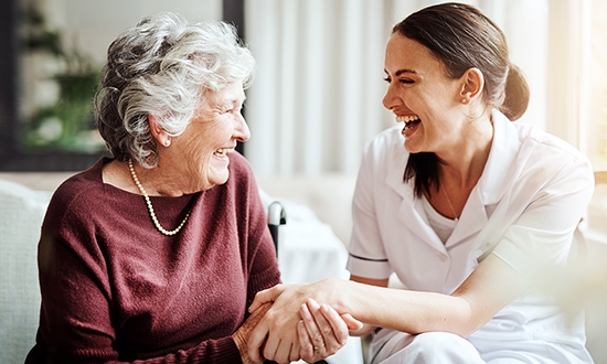 Carer and resident laughing